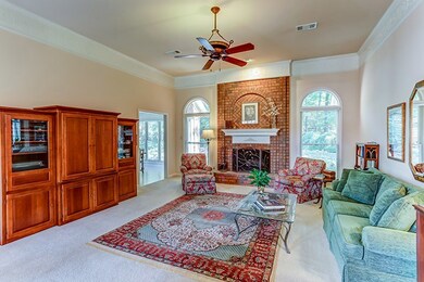 A floor-to-ceiling vented wood burning fireplace f