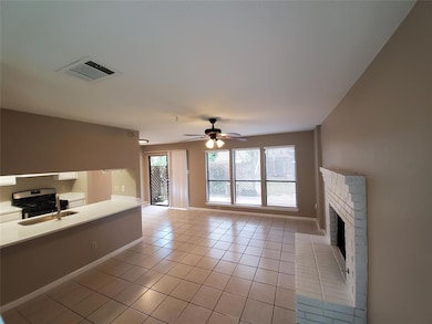 Unfurnished living room featuring light tile patt