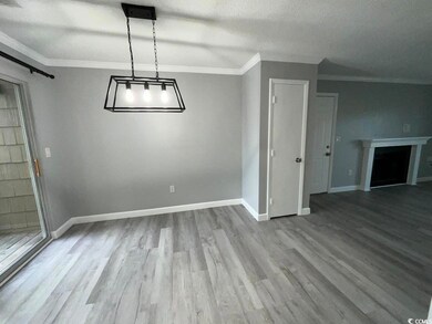 Unfurnished dining area featuring a barn door, a t