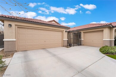 View of front of home featuring a gate, stucco sid