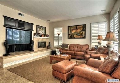 Family Room with Entertainment Center and Cozy Fir