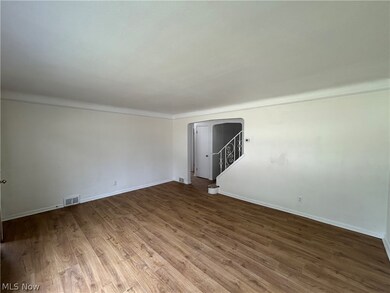 Unfurnished room with hardwood / wood-style floors