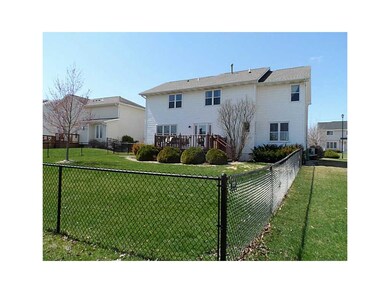 Exterior Back. Fully fenced yard with deck.