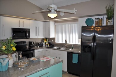 CENTER ISLAND KITCHEN WITH NEW STAINLESS APPLIANCE