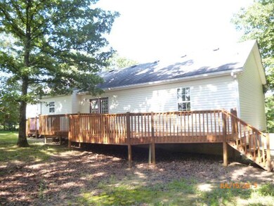 Rear view of home, oversized deck
