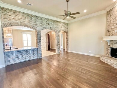 Unfurnished living room with crown molding, ceilin