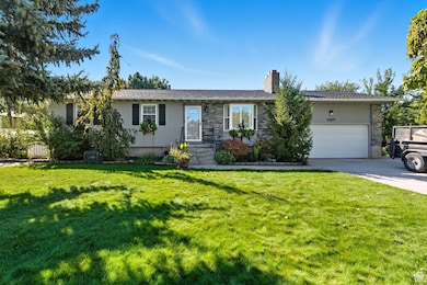 Newly replaced windows, auto sprinklers, spacious yard, flower planters w/stone edging.