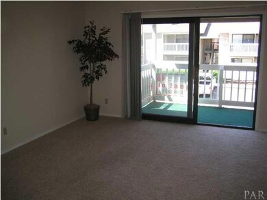 Large Living Room with Energy Efficeint Slider to Balcony and Storage Room.