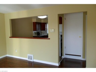 view of kitchen from living room and doorway to up