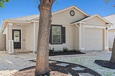 Ranch-style home with an attached garage and a sh