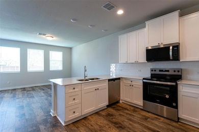 Kitchen featuring appliances with stainless steel