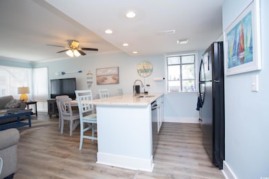 Kitchen with light hardwood / wood-style floors, c