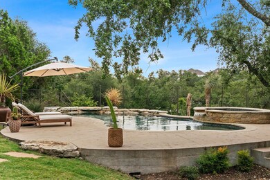 View of swimming pool featuring a patio and a pool with connected hot tub