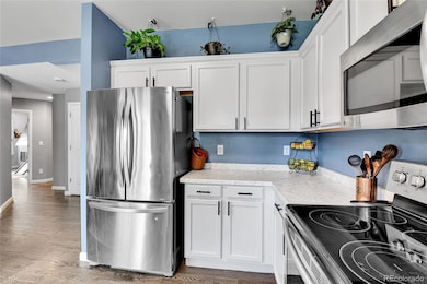 Updated kitchen with hardwood floors and stainless steel!