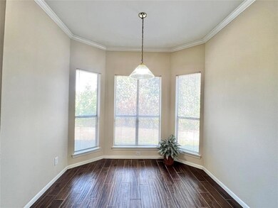 Unfurnished dining area with dark wood-style floo