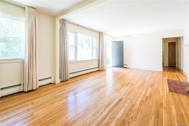 Living/Dining Room with wood burning fireplace and