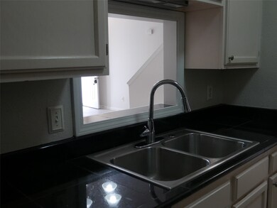 KITCHEN OPEN VIEW TO LIVING AREA