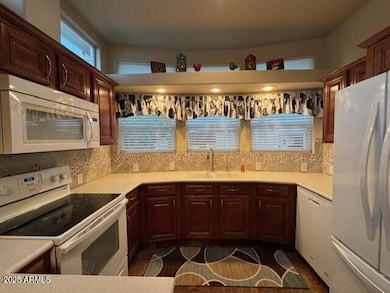 Kitchen with Corian Counters & Tile Back