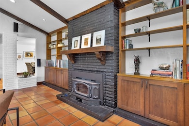 The focal point of the living room is the wood-bur