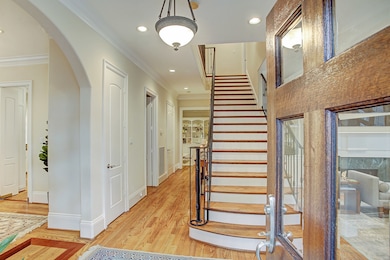 As Old World as the exterior is, the interior was designed for 21st Century living. The center hall plan gives the feel of an open floor plan while still allowing light to flow in and out of defined spaces.