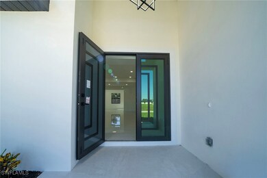 View of exterior entry with stucco siding