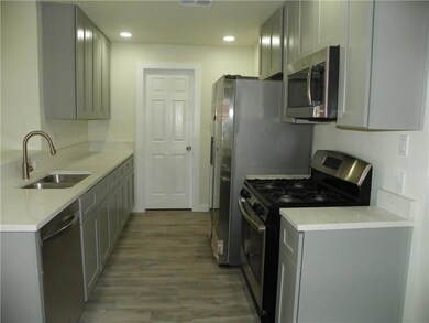 Kitchen featuring appliances with stainless steel