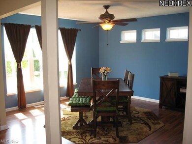 Dining room has modern feel with pillar to keep wi