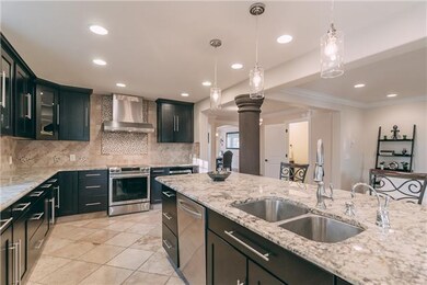 This kitchen is unbelievable! It has so much space for cooking & entertaining! The large bar is perfect!