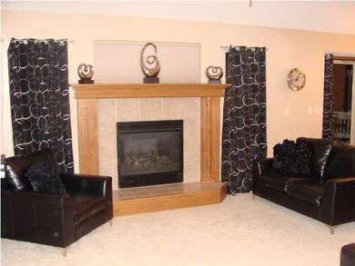 Living room has gas fireplace and view of the lake
