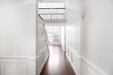 The hallway leads to the living area and kitchen.