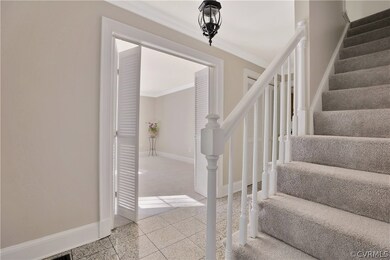 Foyer showing new carpet on stairs and just painte