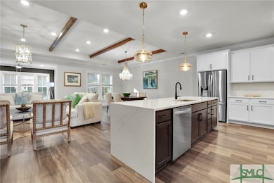 Gorgeous Waterfall Countertops and Wood Beams