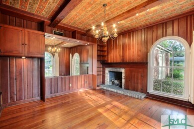 Beautiful pine paneled Den that beamed ceilings an