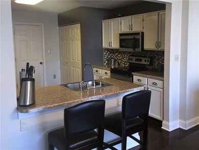 UPDATED KITCHEN WITH HARDWOOD, NEW COUNTERTOPS AND
