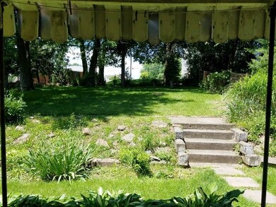 View of back yard from 10x8 covered patio