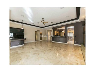 Den. Enormous great room with travertine floors, c
