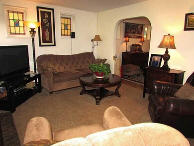 Living Room. There is a Wood Burning Fireplace to 