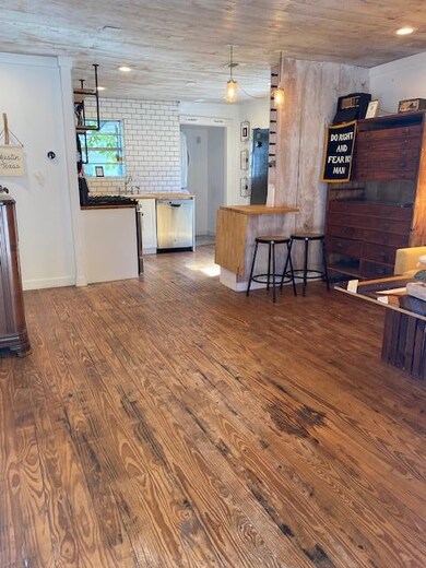 Kitchen with wood finished floors, dishwasher, an