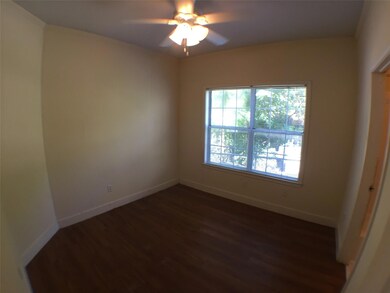 Spare room with baseboards, ceiling fan, and dark
