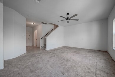 FAMILY ROOM WITH CEILING FAN.