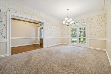 Notice the exquisite millwork in the spacious dini