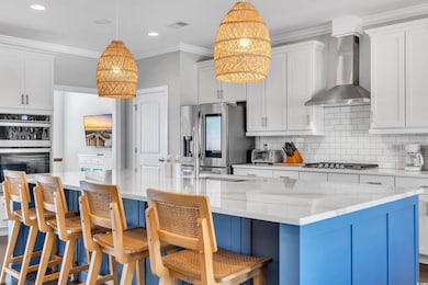 Kitchen featuring stainless steel appliances, tast