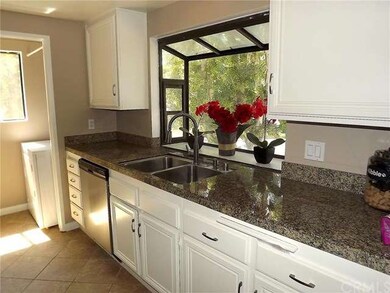 Garden window, designer tile floor and Granite cou