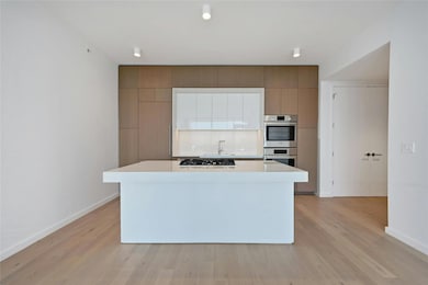 Kitchen featuring light countertops, a kitchen is