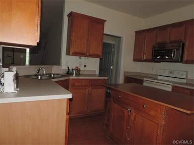 Light maple cabinets, newer microwave and dishwash