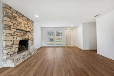 Unfurnished living room with wood finished floors