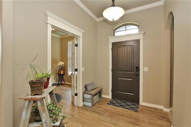 Entry with Wood Look Tile  and Crown , Arched Hall