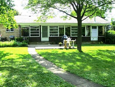Exterior Back. View of 3 season addition along ent