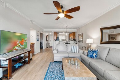 Living room featuring ceiling fan with notable cha