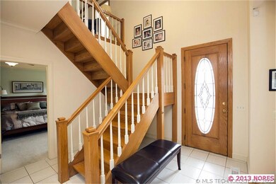 The 2 story entry foyer welcomes visitors to the l